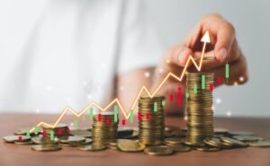 mani che scambiano monete e grafici finanziari